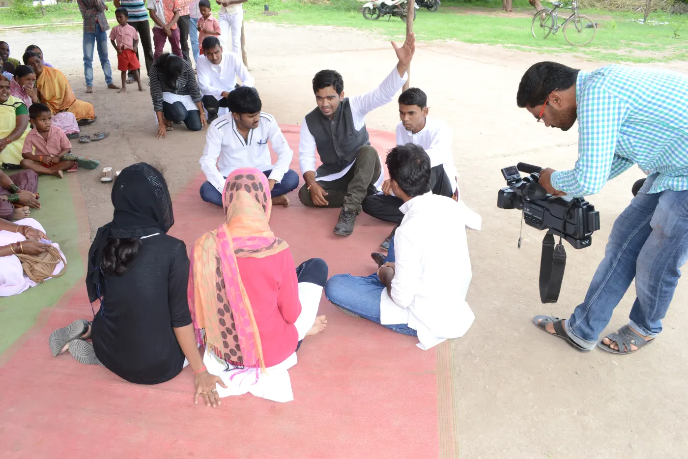 Village meeting with media
